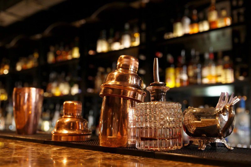 Bar tools arranged on polished countertop