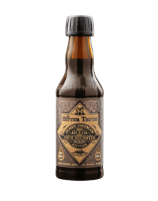 Dark beer bottle with ornate label design.