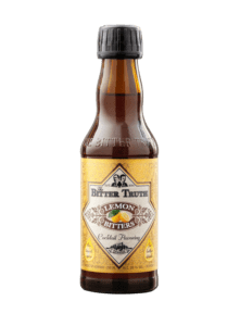 Lemon bitters bottle on black background.
